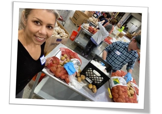 Yukon Learning team member volunteering at her local food bank.